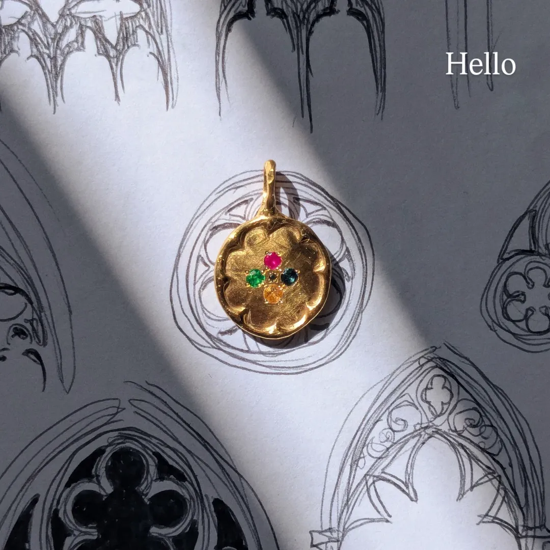 Gold pendant worn